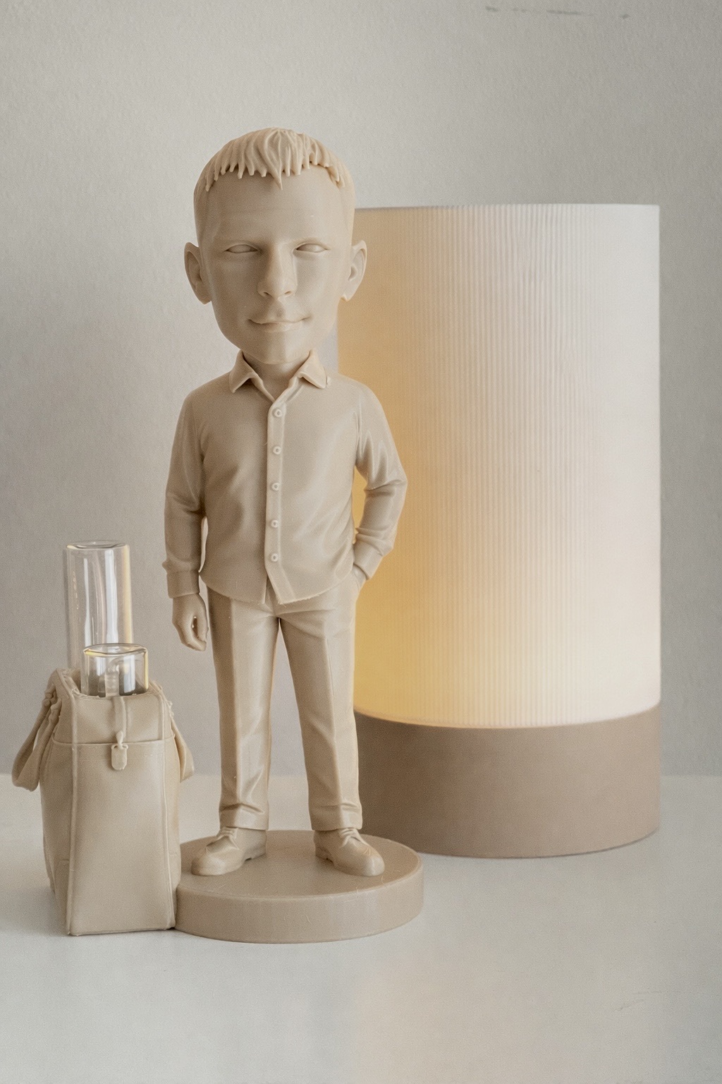 3D figurine of a man in sunglasses - artistic styling with an enlarged head